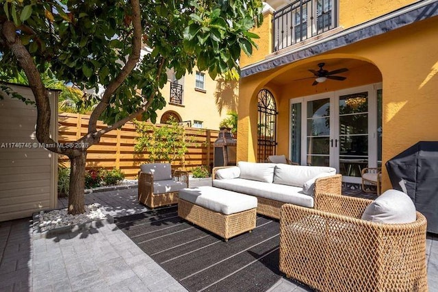 view of patio featuring grilling area, an outdoor hangout area, and ceiling fan