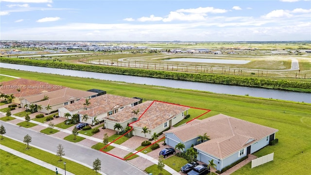 drone / aerial view featuring a water view