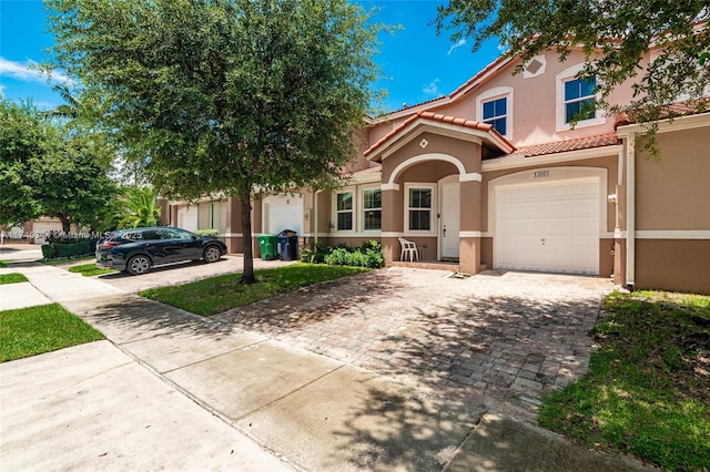 view of front of property with a garage