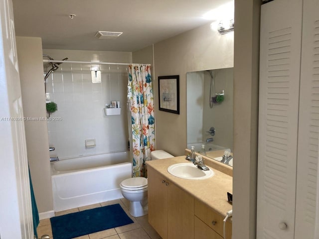 full bathroom featuring shower / bath combination with curtain, vanity, tile patterned floors, and toilet