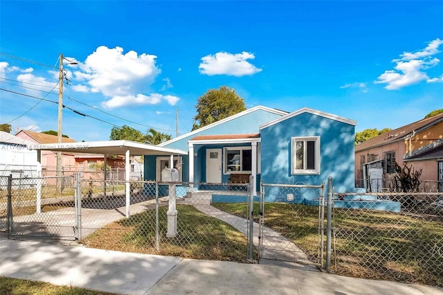 4711 NW 11th Ave, Miami, FL 33127 - view of front facade with a gate, a fenced front yard, and a porch