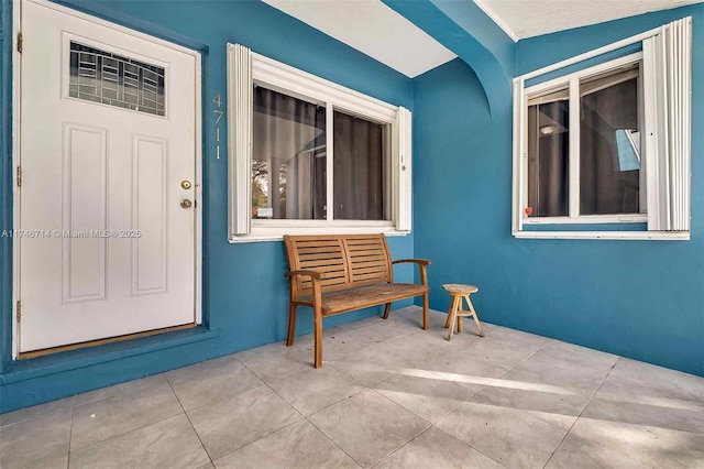 4711 NW 11th Ave, Miami, FL 33127 - property entrance featuring stucco siding and a patio