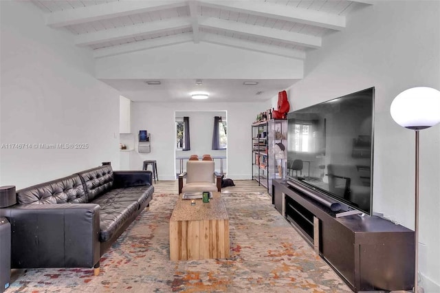 4711 NW 11th Ave, Miami, FL 33127 - living area with lofted ceiling with beams, baseboards, and wood finished floors