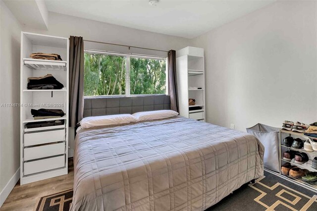 4711 NW 11th Ave, Miami, FL 33127 - bedroom with baseboards and wood finished floors