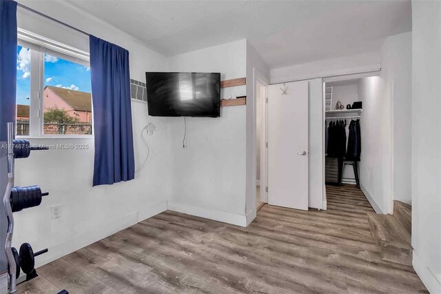 4711 NW 11th Ave, Miami, FL 33127 - bedroom featuring a closet and wood finished floors