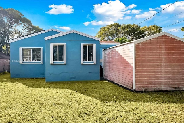 4711 NW 11th Ave, Miami, FL 33127 - view of side of home featuring crawl space and a lawn