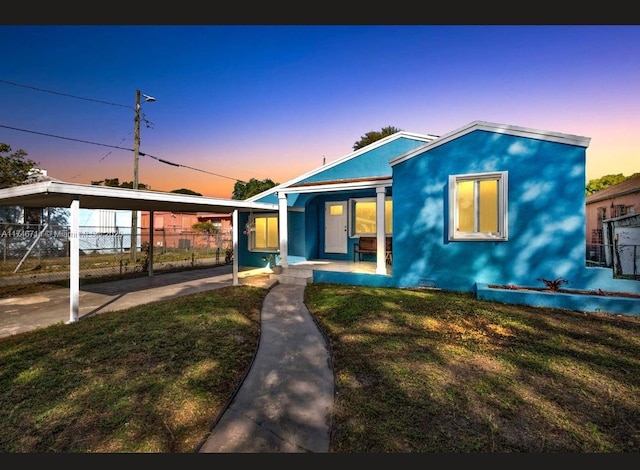 4711 NW 11th Ave, Miami, FL 33127 - view of front of house with a porch, fence, and a front lawn