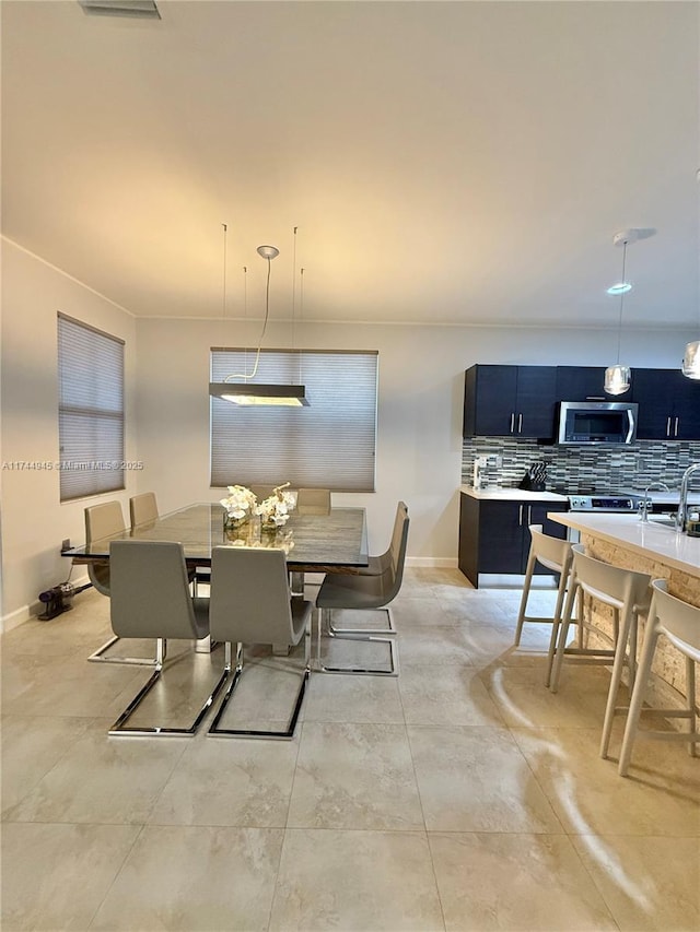 dining space featuring baseboards