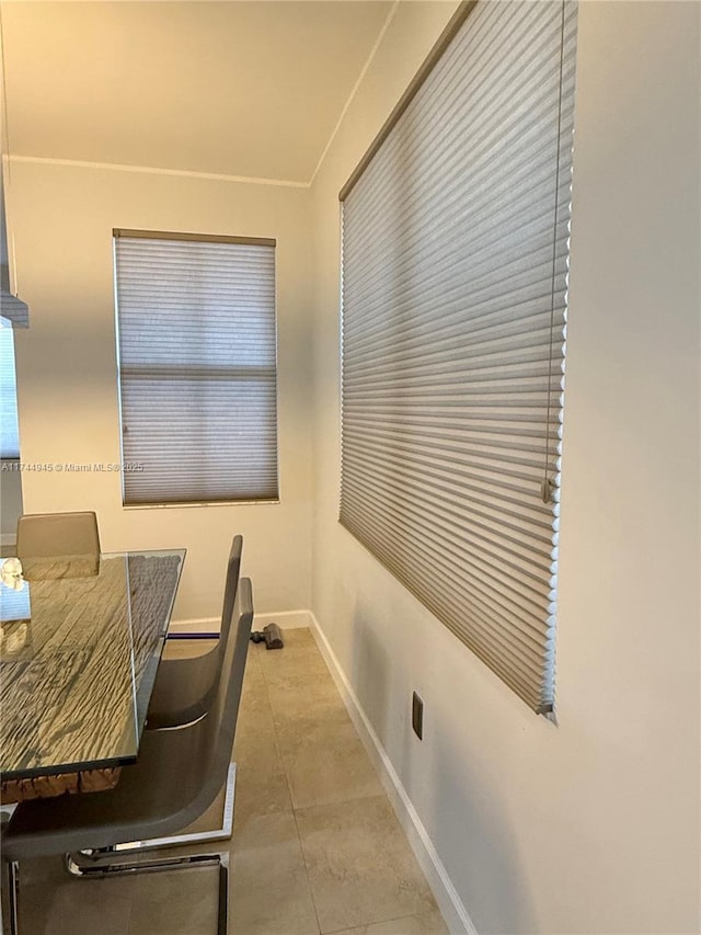 office with light tile patterned flooring and baseboards