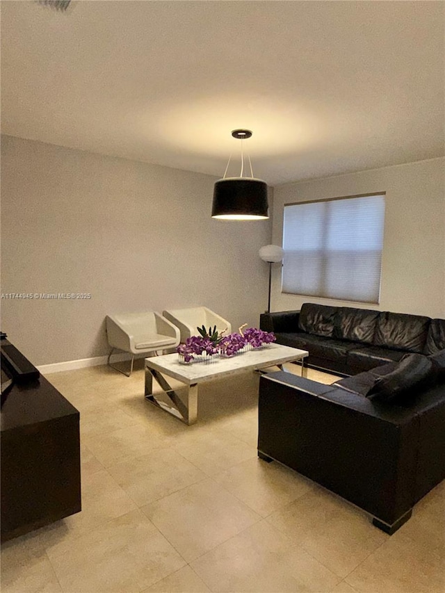 living room featuring baseboards
