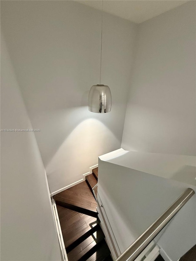 stairway with wood finished floors