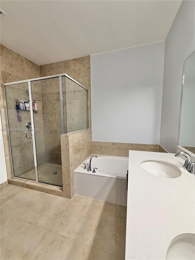 full bath with a bath, a stall shower, tile patterned flooring, and vanity