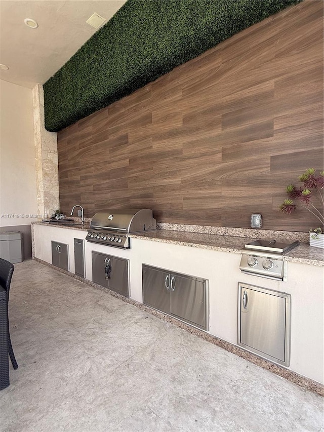 view of patio / terrace with exterior kitchen and area for grilling