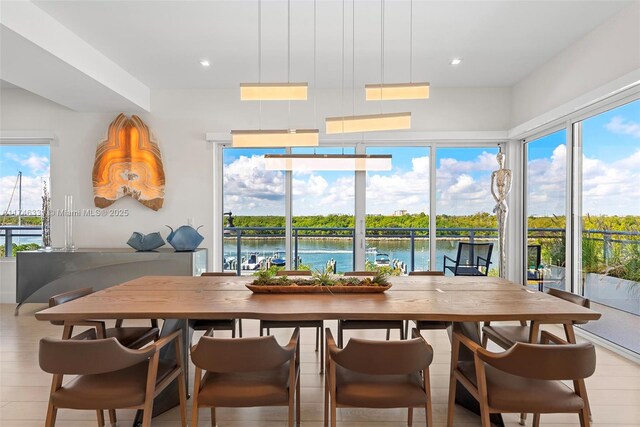 350 Desoto St, Hollywood, FL 33019 - dining room with a water view and light hardwood / wood-style floors