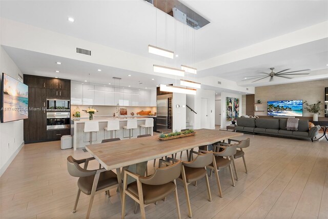 350 Desoto St, Hollywood, FL 33019 - dining space with ceiling fan, sink, and light wood-type flooring