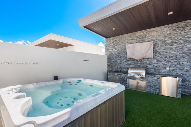 350 Desoto St, Hollywood, FL 33019 - view of patio featuring a hot tub, an outdoor kitchen, sink, and grilling area