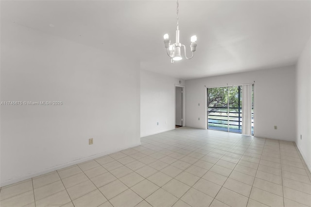 empty room with an inviting chandelier