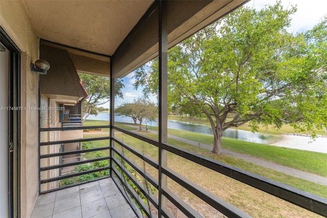 balcony featuring a water view