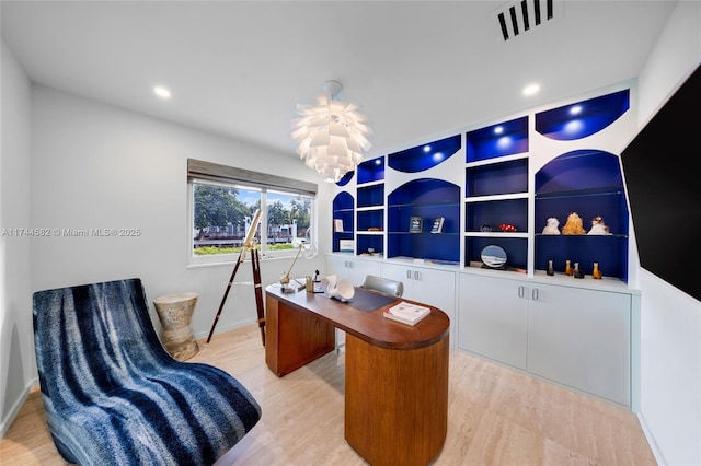 office featuring light wood-type flooring, visible vents, a notable chandelier, and recessed lighting