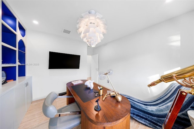 office area with light wood-style flooring, visible vents, a notable chandelier, and recessed lighting