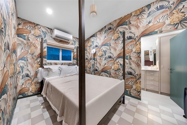 bedroom featuring a wall unit AC and tile patterned floors