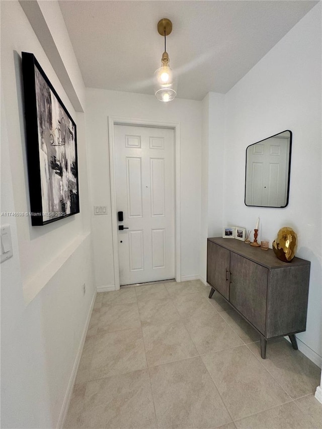 entrance foyer featuring light tile patterned flooring