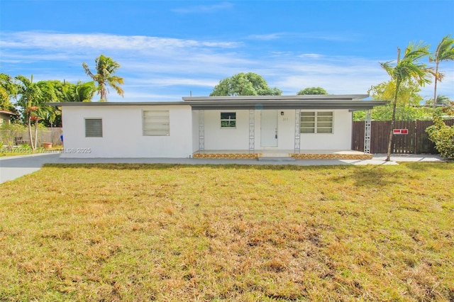 ranch-style home with a front yard and a porch