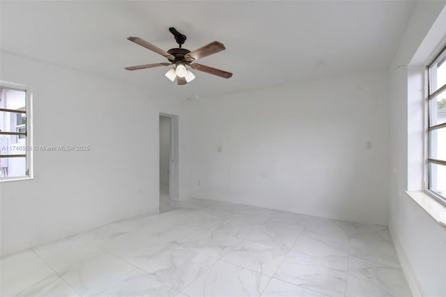 unfurnished room with ceiling fan