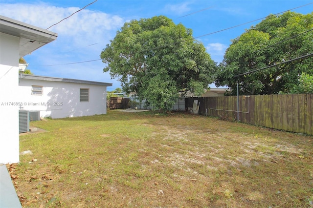 view of yard with central AC unit