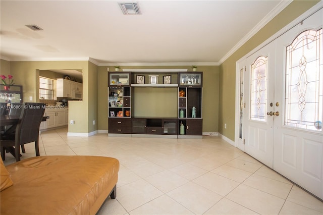 living room featuring baseboards, visible vents, crown molding, french doors, and light tile patterned flooring