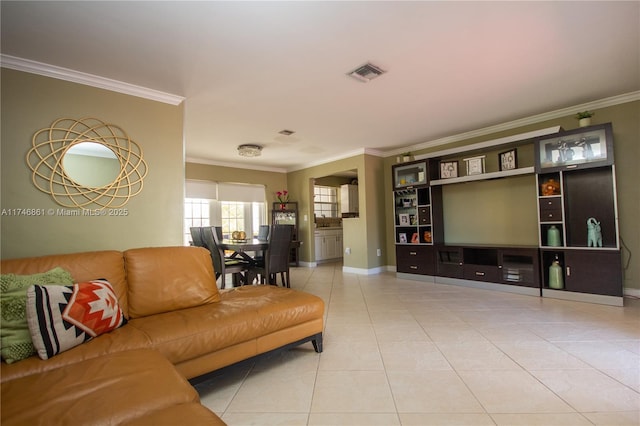living area featuring crown molding, baseboards, visible vents, and tile patterned floors