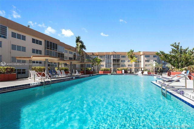 view of swimming pool with a patio