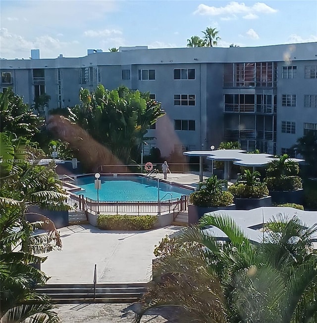 view of swimming pool featuring a patio area