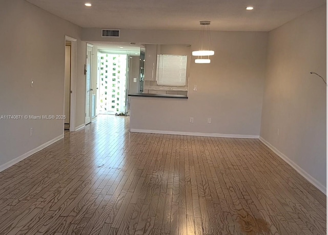 spare room featuring hardwood / wood-style flooring