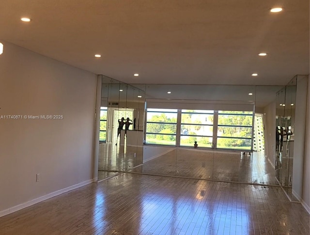 spare room featuring hardwood / wood-style floors