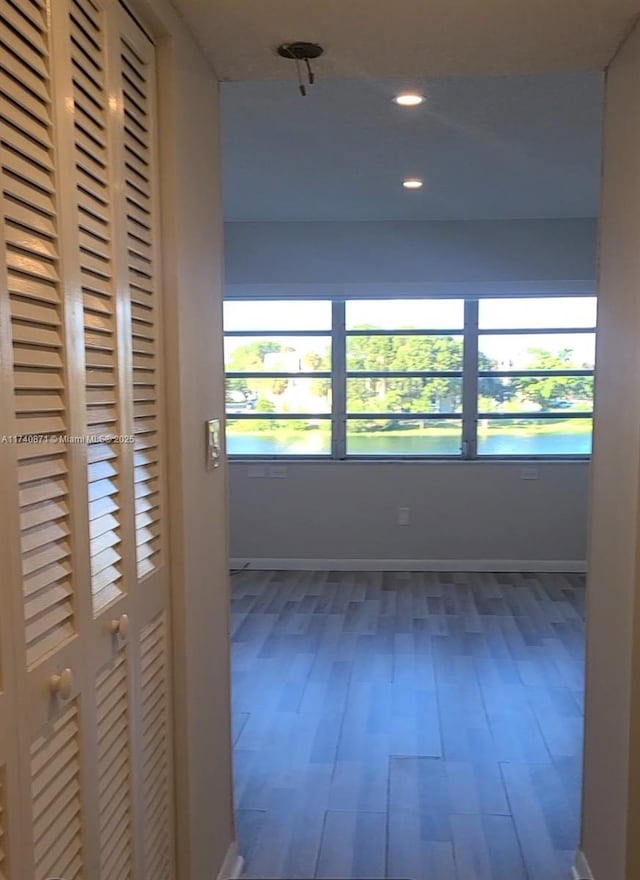 hall with dark hardwood / wood-style flooring