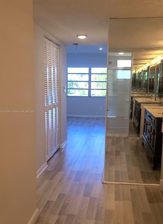 corridor featuring hardwood / wood-style flooring