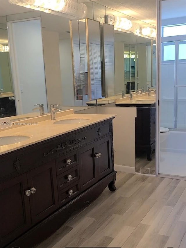 bathroom with vanity and hardwood / wood-style floors