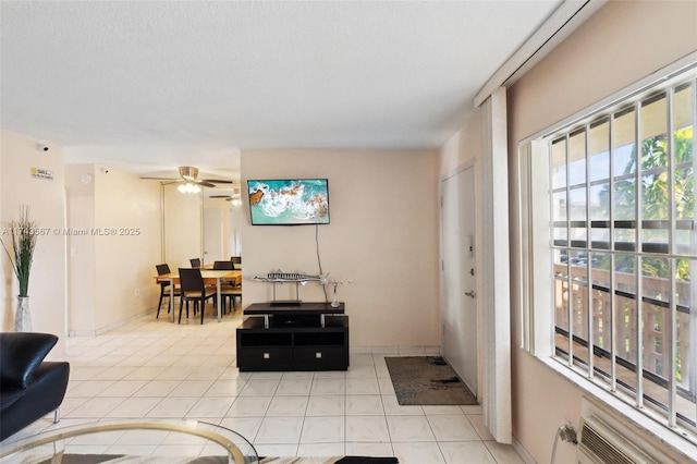 tiled living room featuring ceiling fan