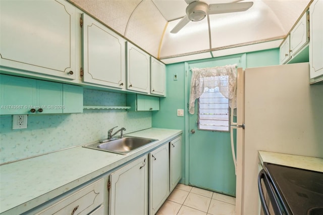 kitchen with backsplash, ceiling fan, sink, and white cabinets
