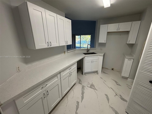 kitchen with sink and white cabinets