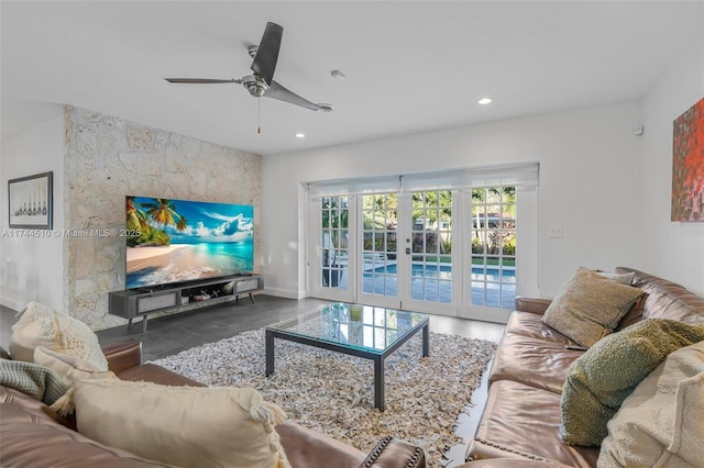 living room featuring ceiling fan and french doors