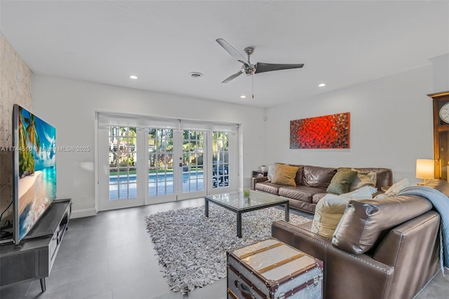 living room featuring french doors and ceiling fan