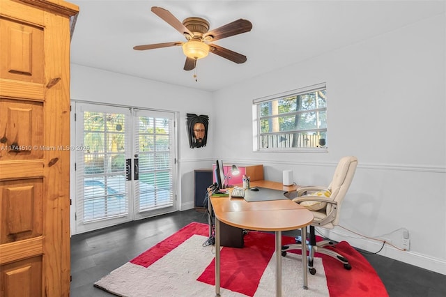 office space featuring french doors, ceiling fan, dark hardwood / wood-style flooring, and a wealth of natural light