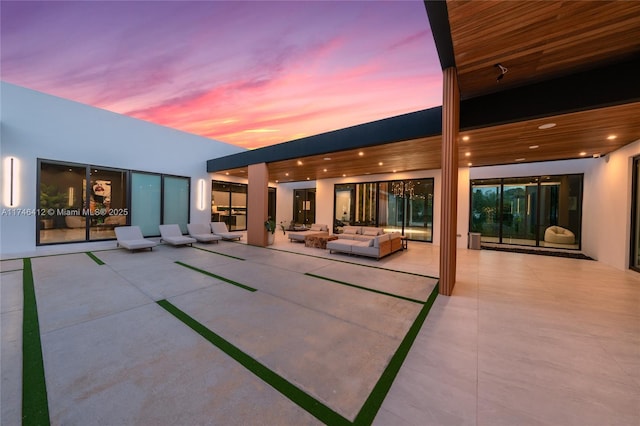 patio terrace at dusk with an outdoor hangout area