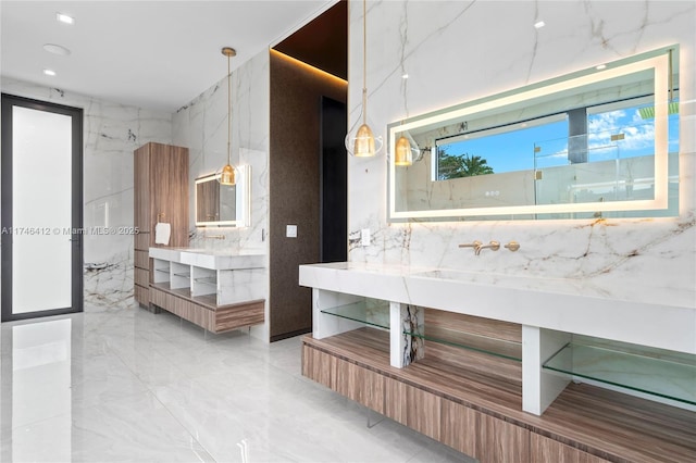 bathroom featuring vanity and tile walls