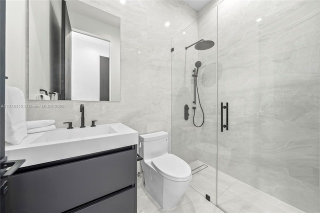 bathroom featuring vanity, toilet, an enclosed shower, and tile walls