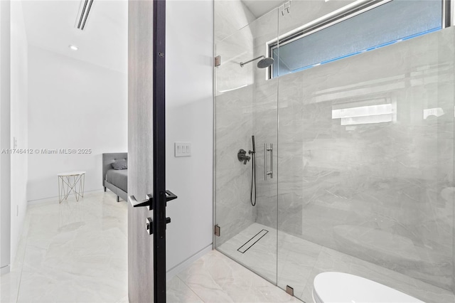 bathroom featuring toilet and a shower with shower door