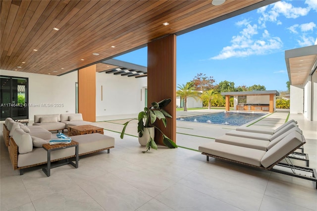 view of patio with pool water feature and an outdoor living space