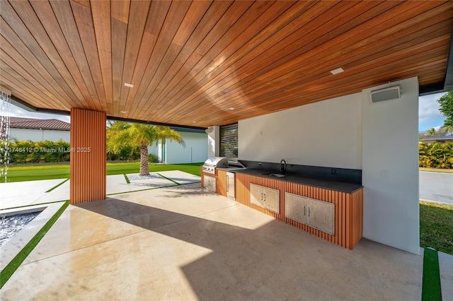 view of patio / terrace with area for grilling and sink